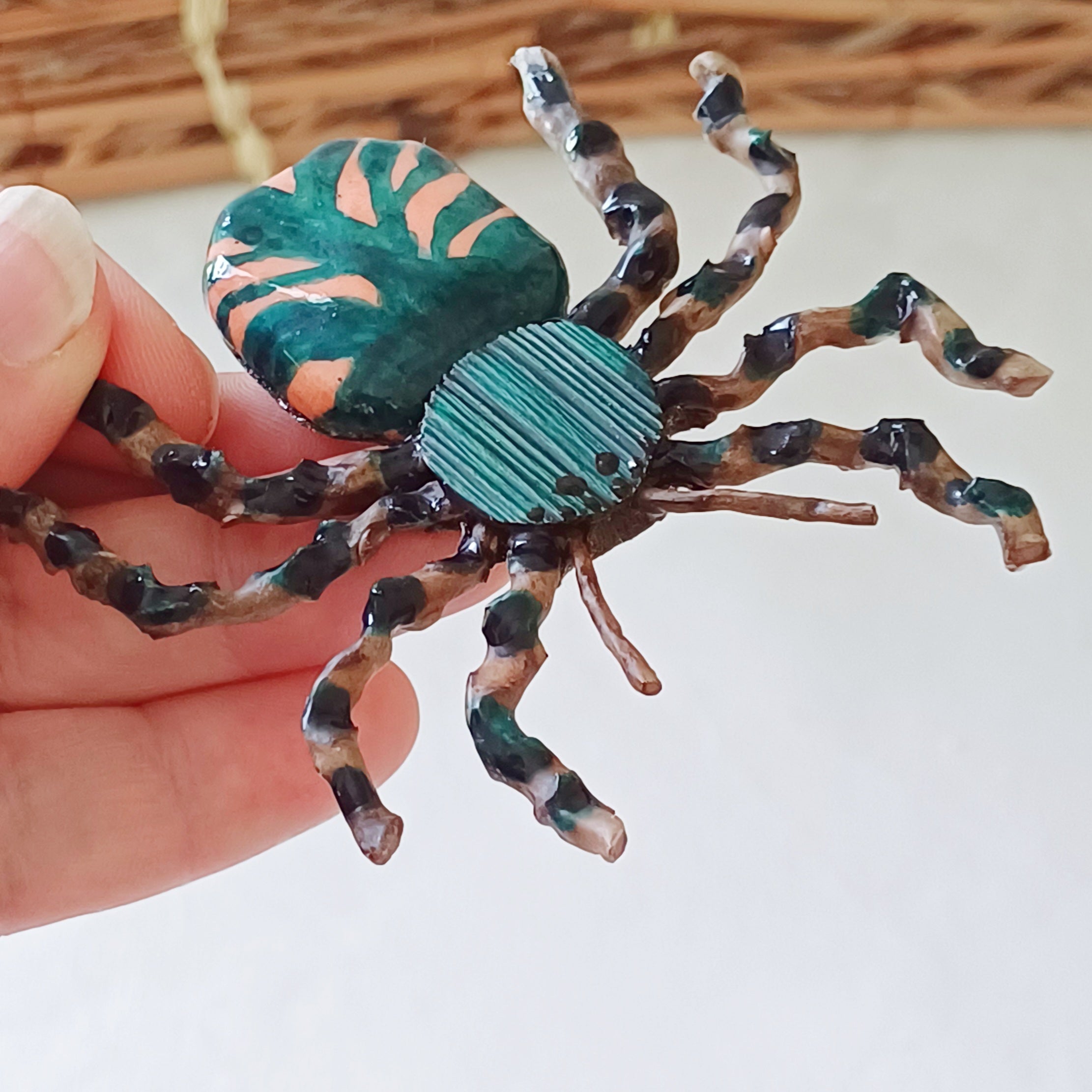 Hand painted teal palm leaf clay spider keepsake with magnet