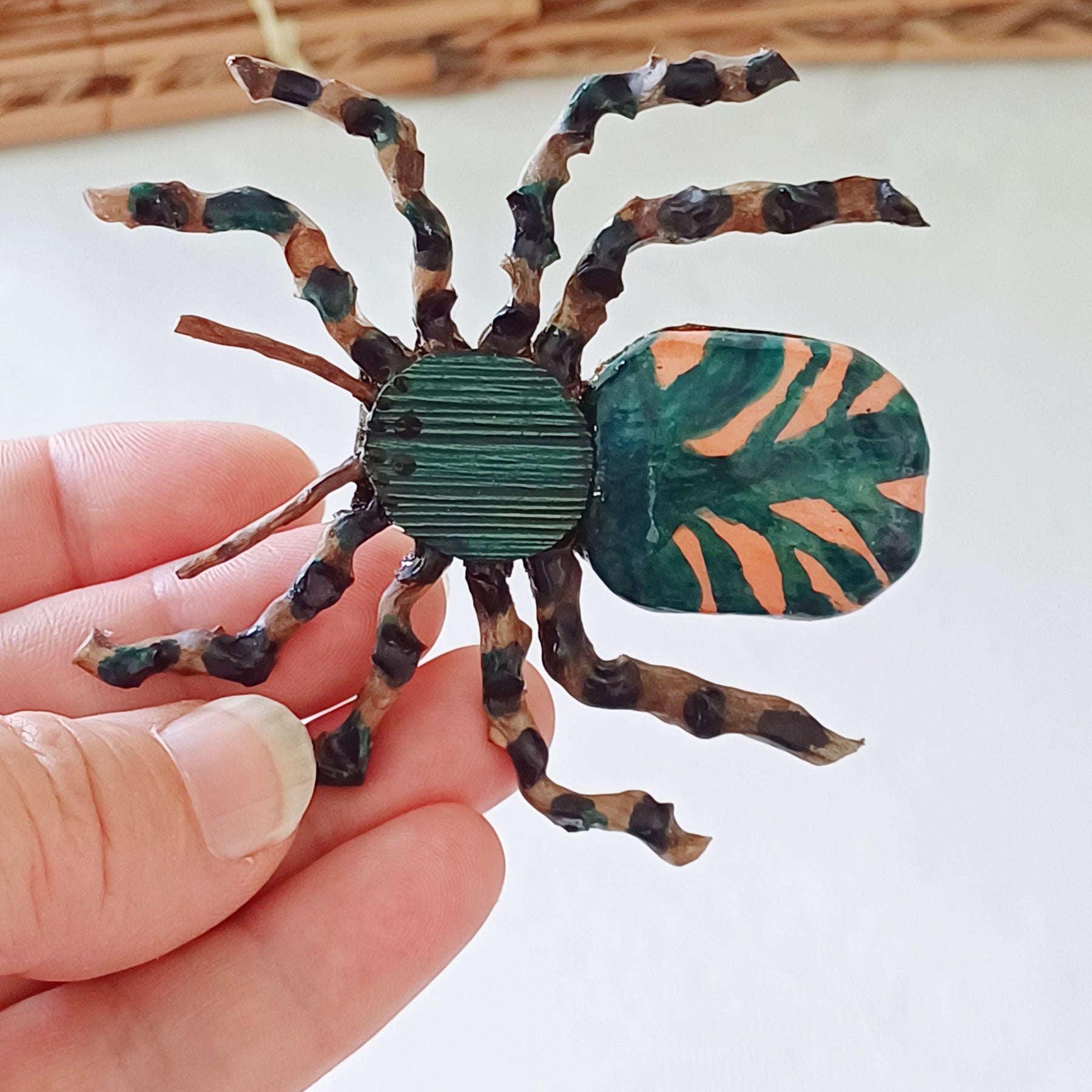 Hand painted teal palm leaf clay spider keepsake with magnet