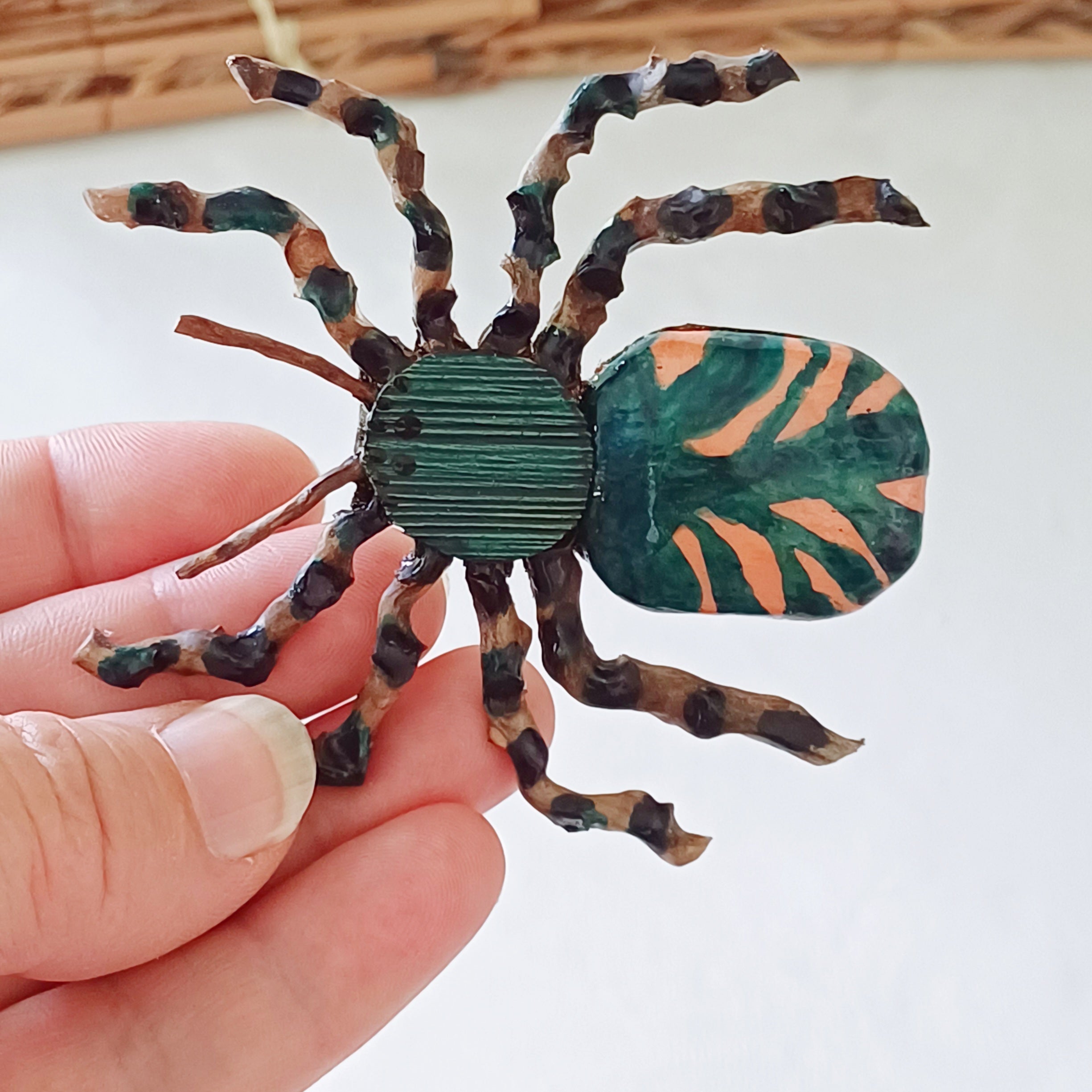 Hand painted teal palm leaf clay spider keepsake