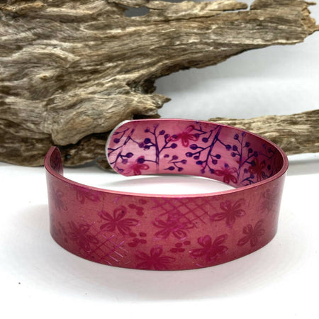 Printed and dyed pink on pink anodised aluminium bangle