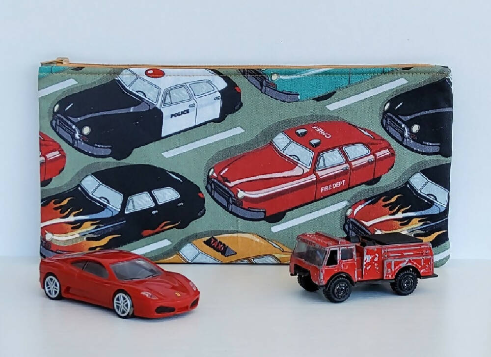 Zippered pouch with cars.