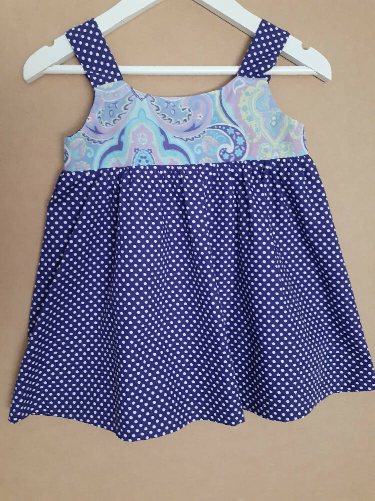 Cute size 2 child's dresses. One-Of-A-Kind Print Bodice with Contrasting Spots. Available in 2 colours.
