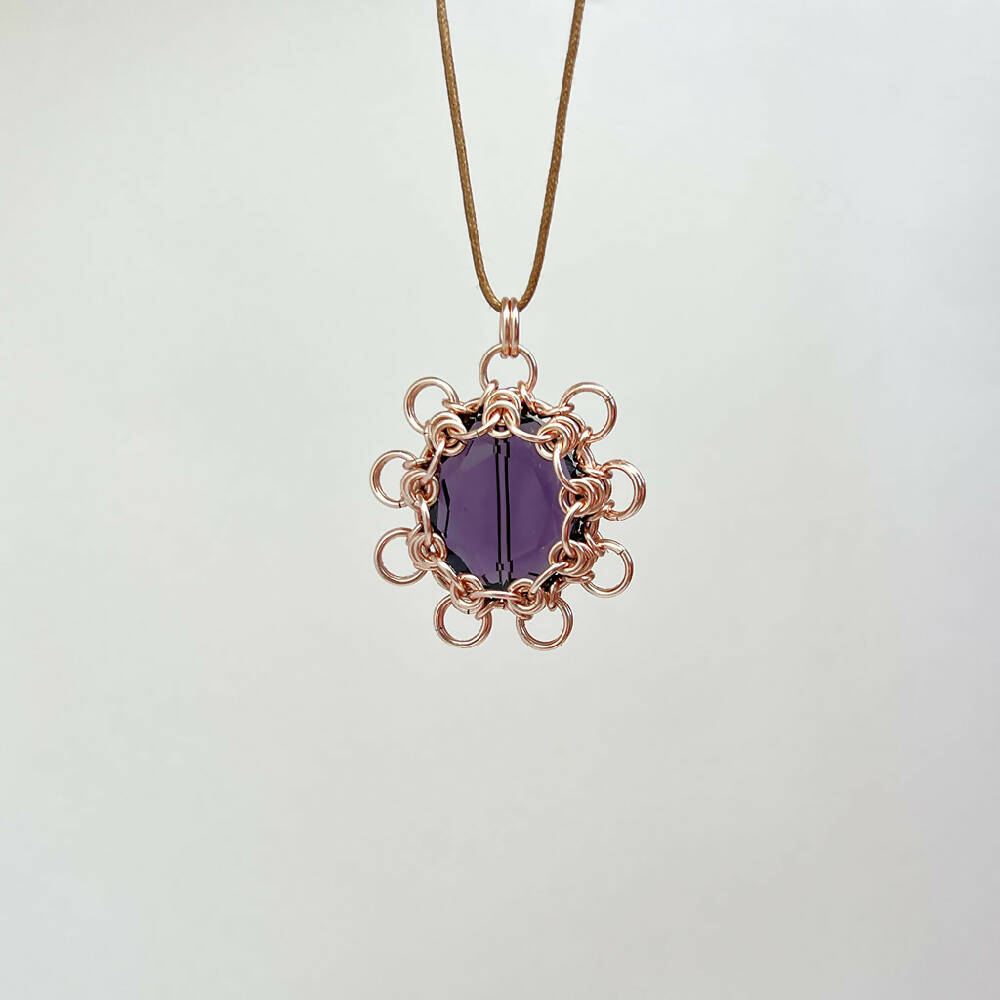 Purple bead caged pendant front