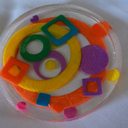 Patterned resin coaster with polymer clay inclusions