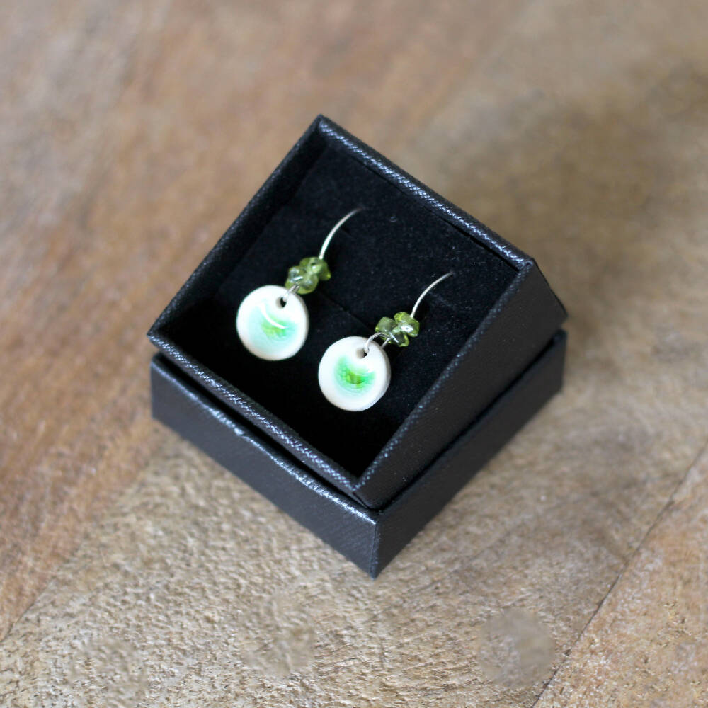 Ceramic silver dangle earrings with peridot beads