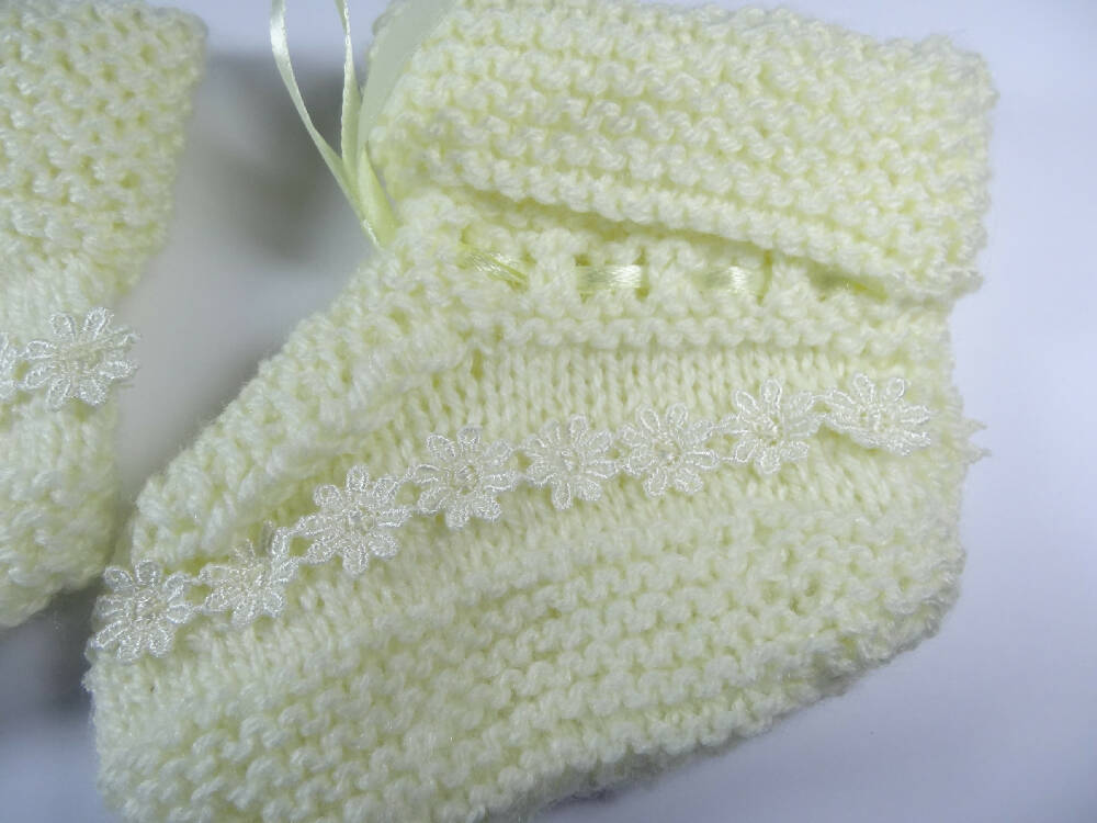 Lemon Bootees with lace trim.