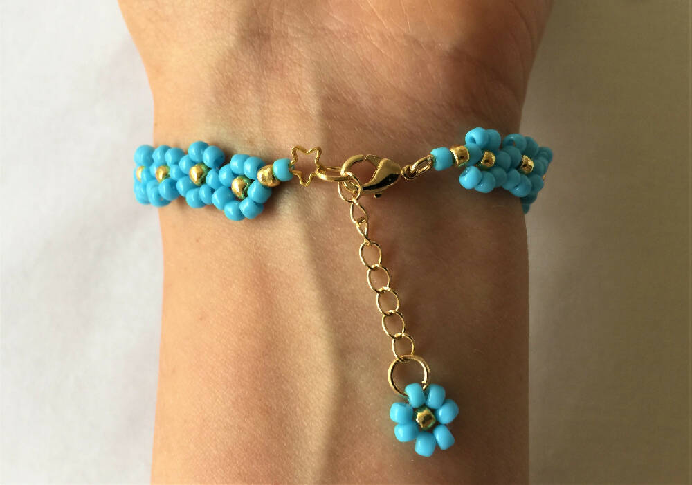 on the hand Naryanabeads clasp of light blue beaded bracelet