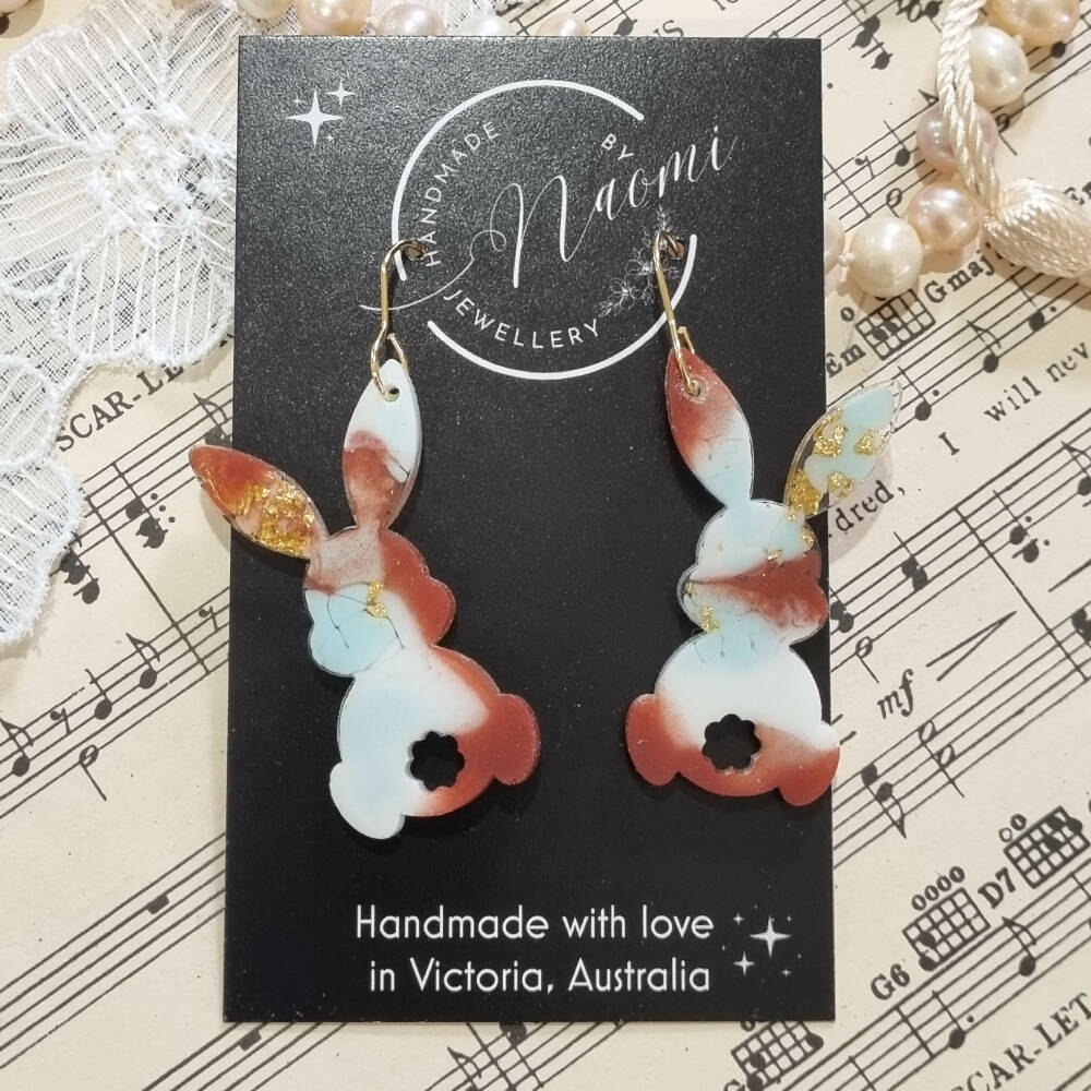 Red, blue and gold resin rabbit dangle earrings