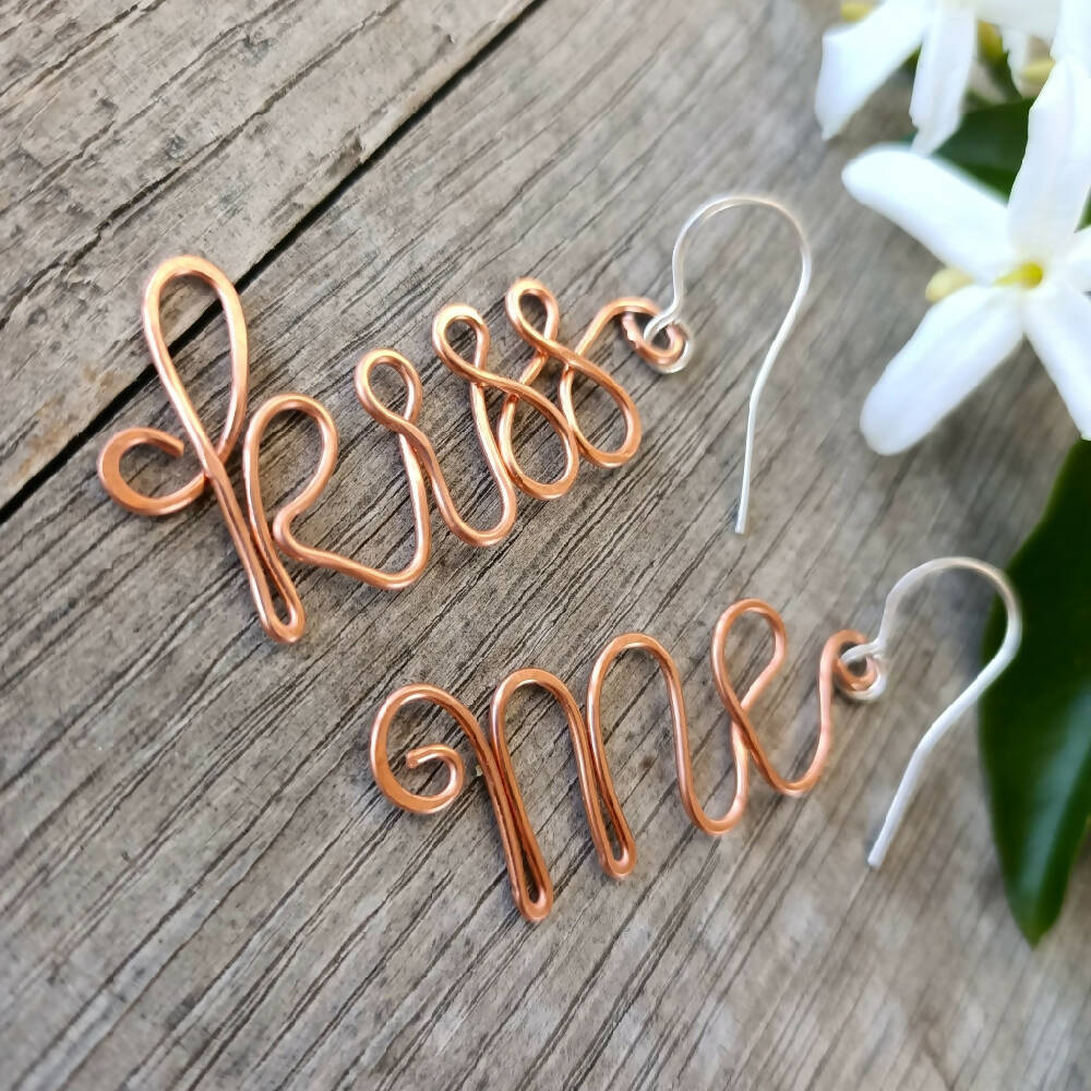 handmade kiss me earrings copper and silver close up
