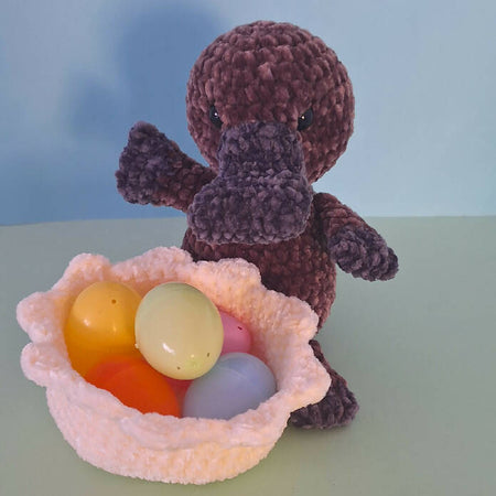velvet crocheted baby platypus in egg shell