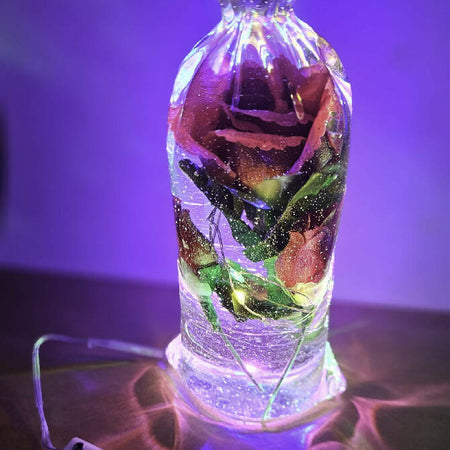 Clear Resin bottle with roses and coloured lights