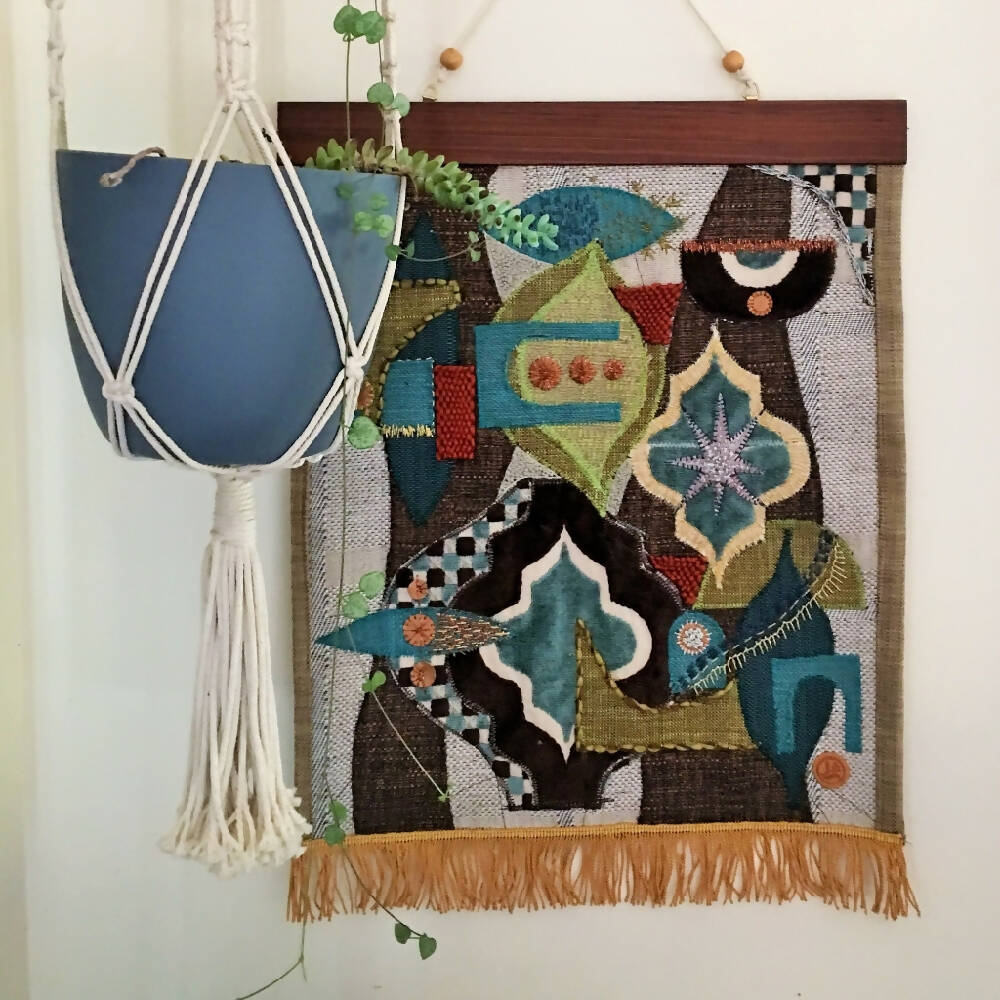 Velvet wallhanging with plant