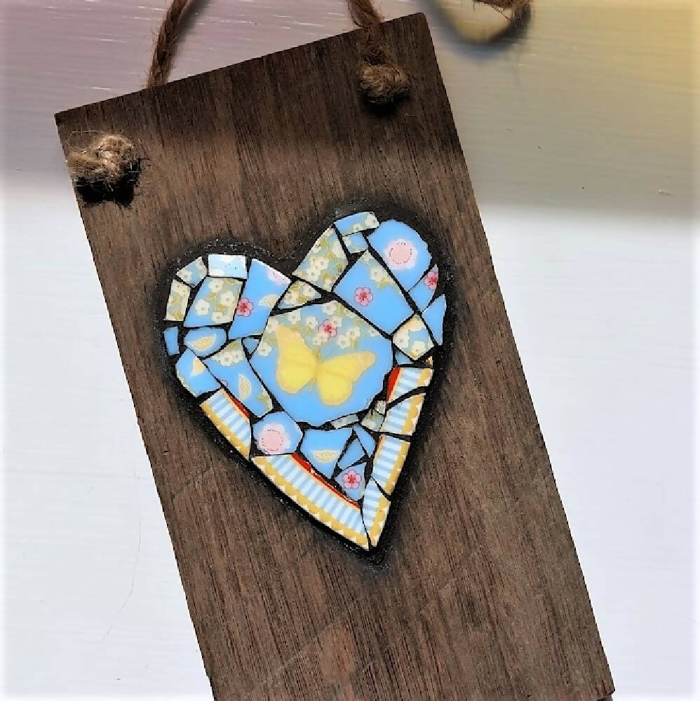 Broken china mosaic heart wall hanging, yellow butterfly mosaic on old timber