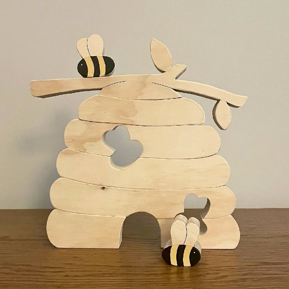 Wooden Beehive stacking puzzle with 2 bees.