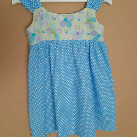Cute size 4 child's dresses. One-Of-A-Kind Print Bodice with Contrasting Spots. Available in 2 colours.