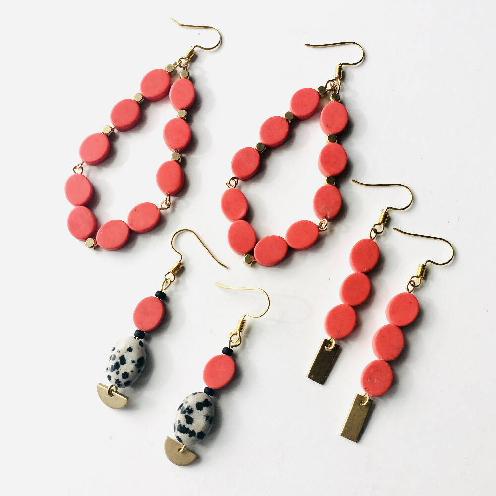 abacus designs red statement dangly earrings