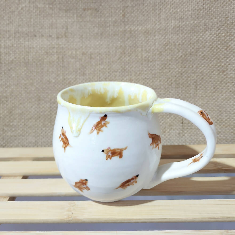 lemon yellow glazed porcelain tassie devil doodle mug, handmade in tassie