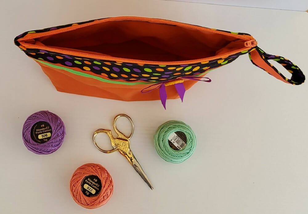 Orange, purple and lime zippered pouch.