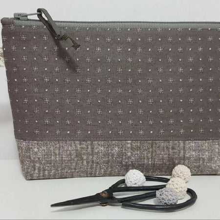 Taupe zippered pouch/bag.