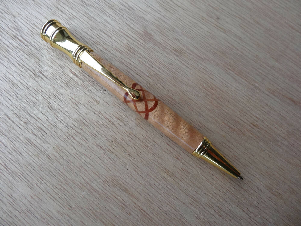 Curly Maple with a red gum insert celtic knot Secret Top pen