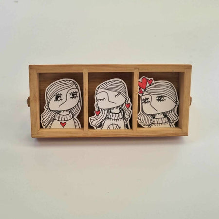 Three sisters Lorna, Laura and Lola original line art in a wooden frame