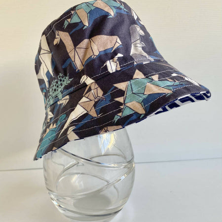 Summer hat in origami dinosaur fabric