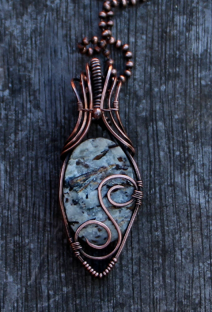 Raw Astrophyllite in Copper with chain