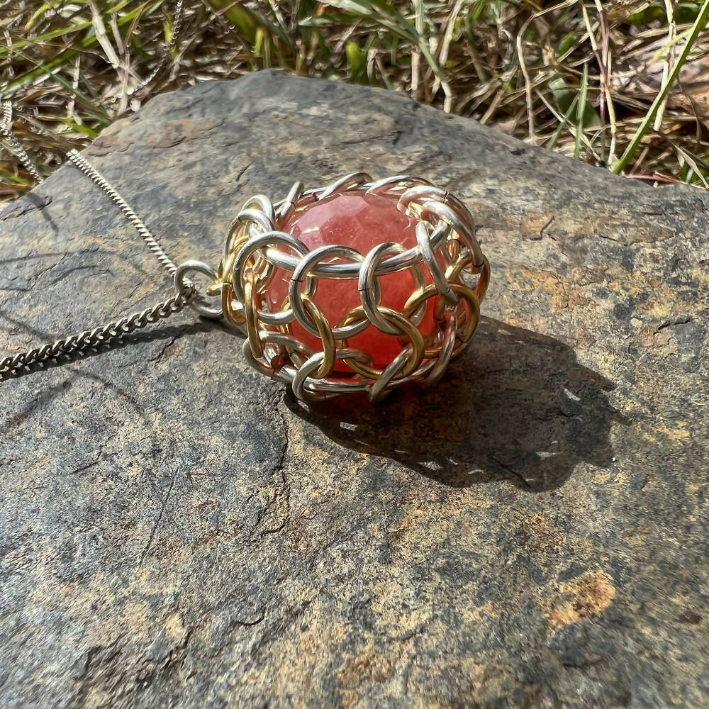 Rose quartz caged pendant, gold & silver profile
