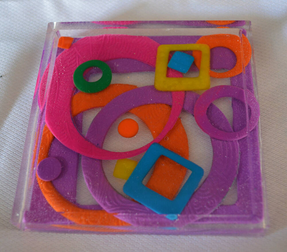 Patterned resin coaster with polymer clay inclusions