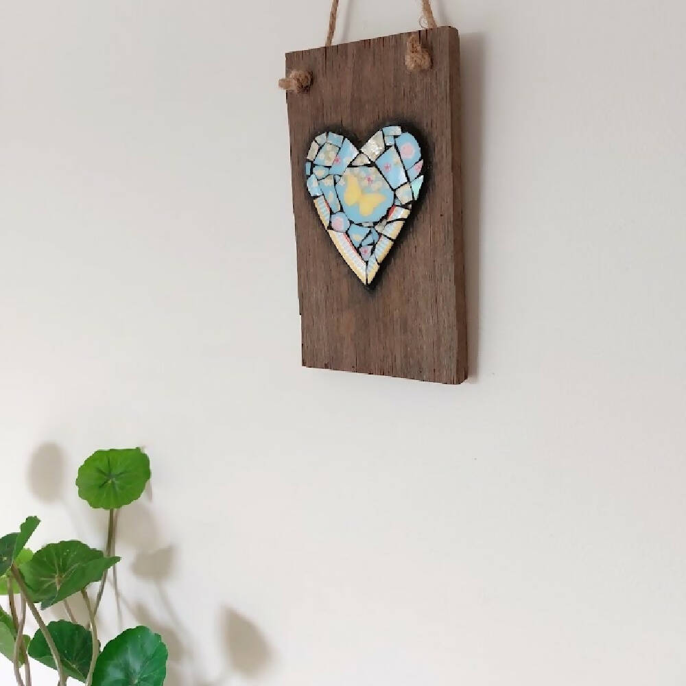 Broken china mosaic heart wall hanging, yellow butterfly mosaic on old timber