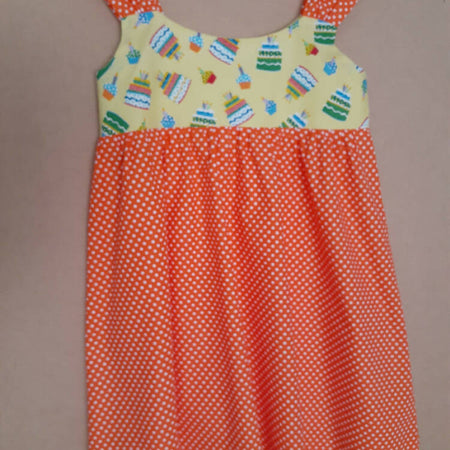 Cute size 6 child's dresses. One-Of-A-Kind Print Bodice with Contrasting Spots. Available in 2 colours.