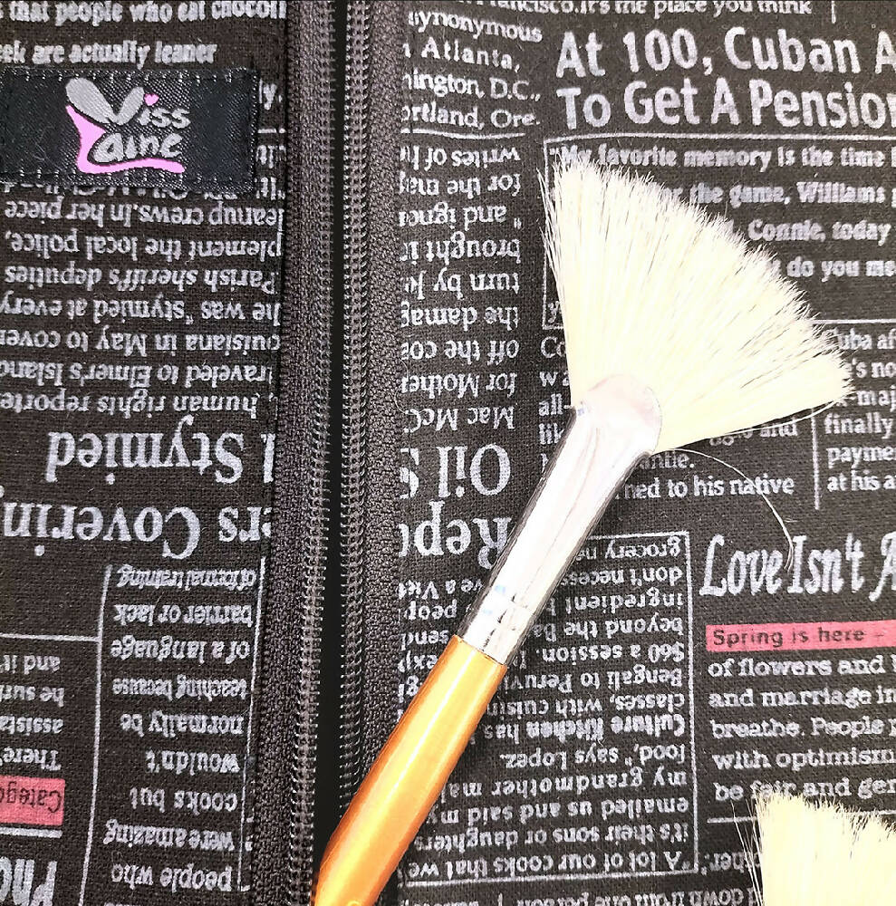 Accessory  waterproof bag. Toiletry bag. Newspaper print