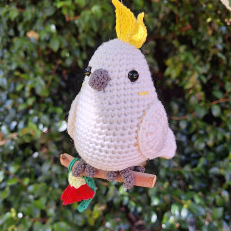 crocheted sulphur crested cockatoo on perch room decoration