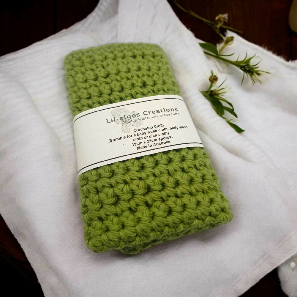 LaC, Sage Green Crocheted Cloths on a Dark Table with Flowers, 7.1.2025