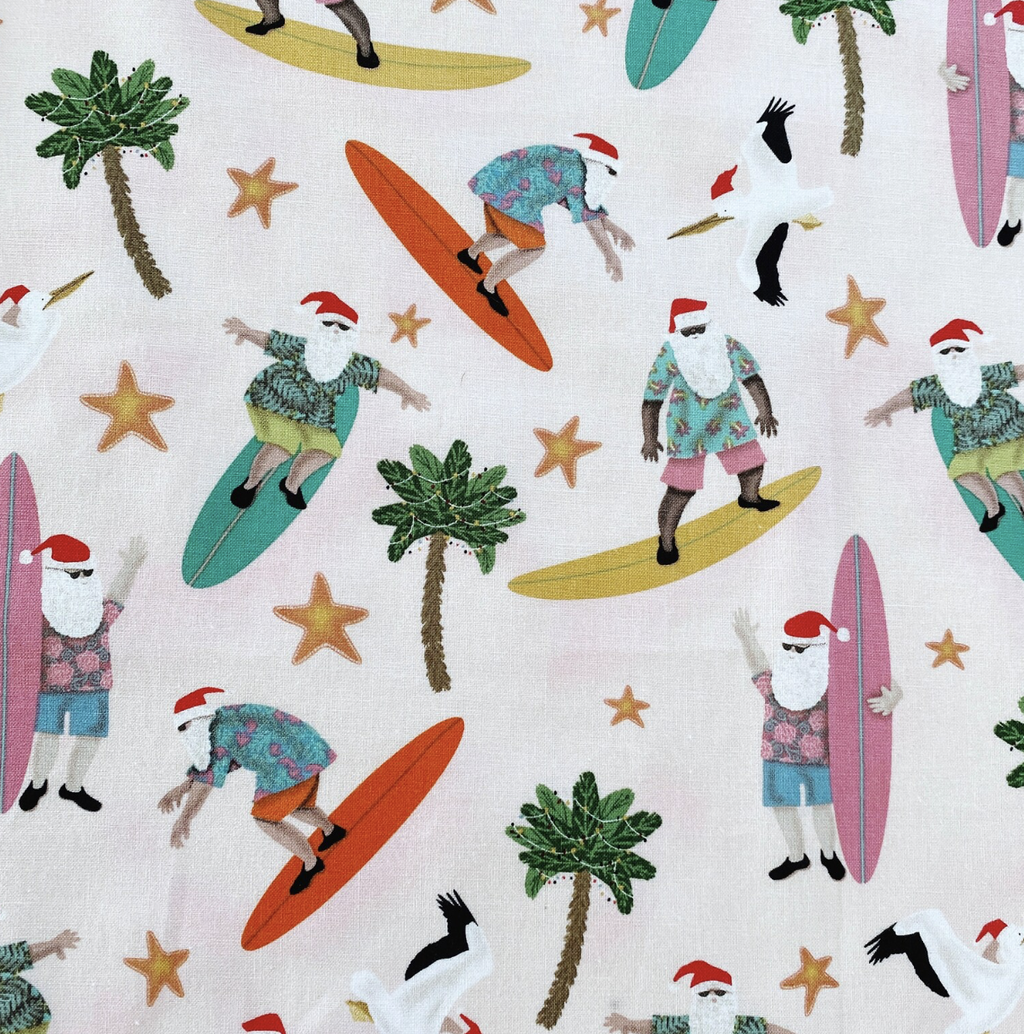 Surfing Santas. Ladies' Christmas tie back apron.