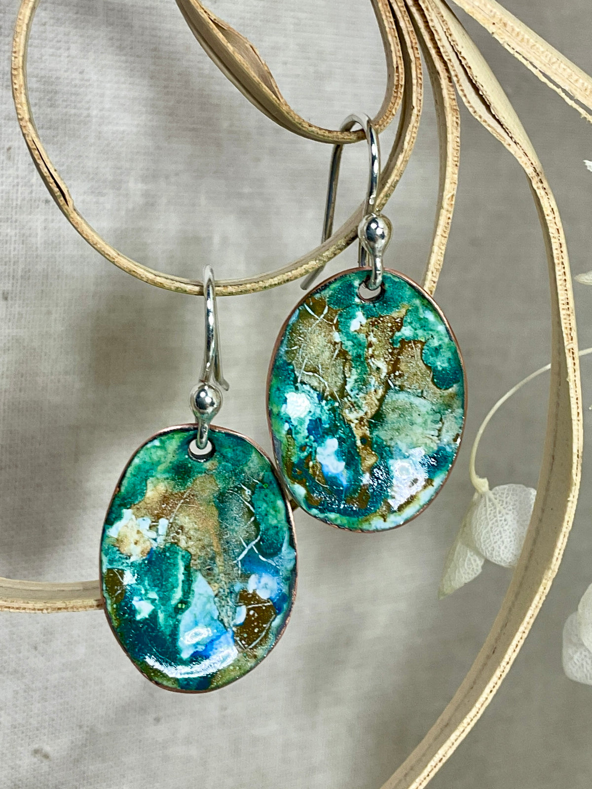 Blue and earthy brown oval abstract enamel earrings. Handmade