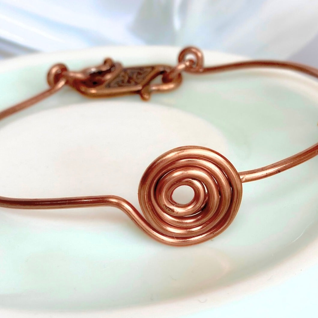 Simple antique copper spiral bracelet | Bangle with Triquetra clasp | Celtic-inspired jewellery