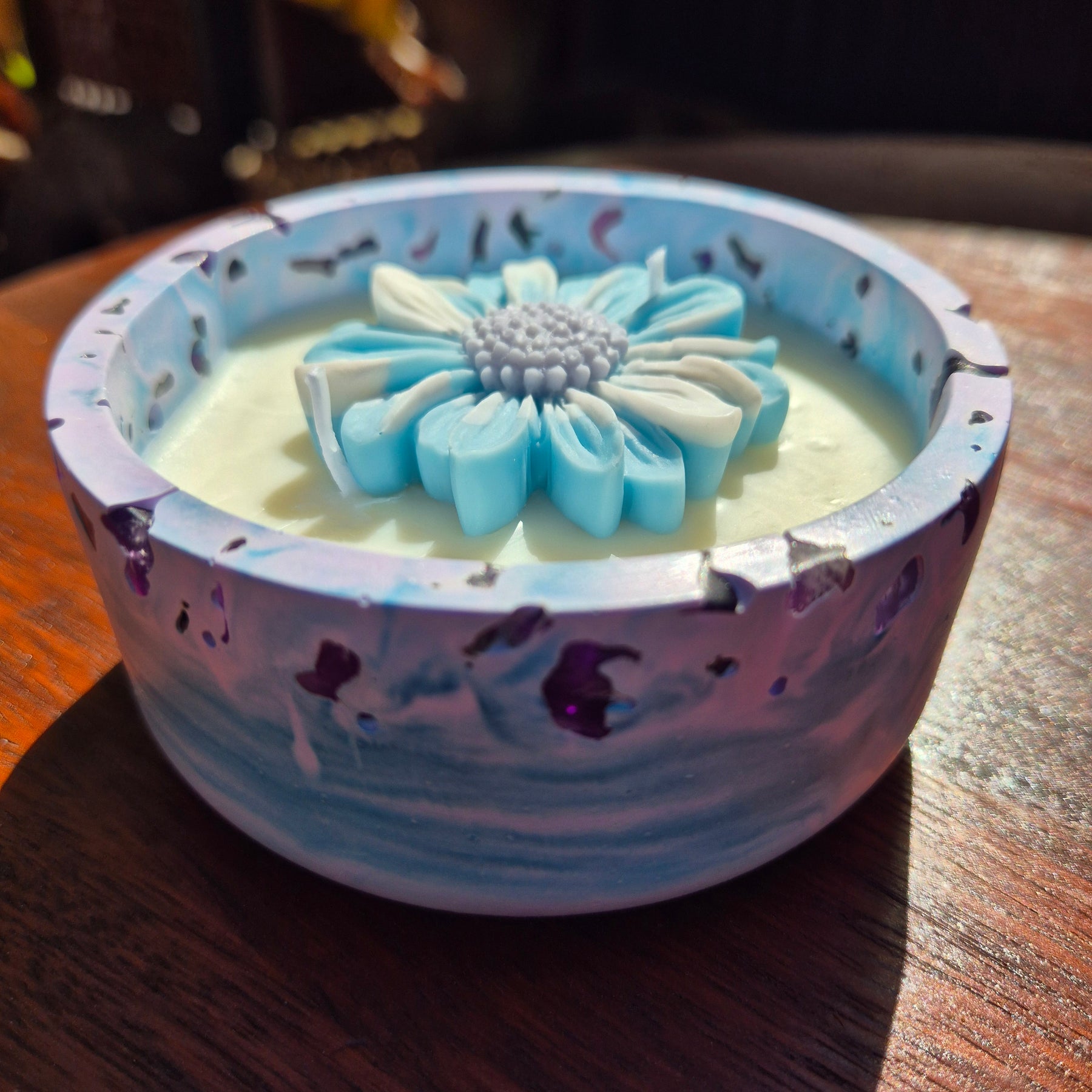 Round blue and purple concrete bowl candle with amethyst stones