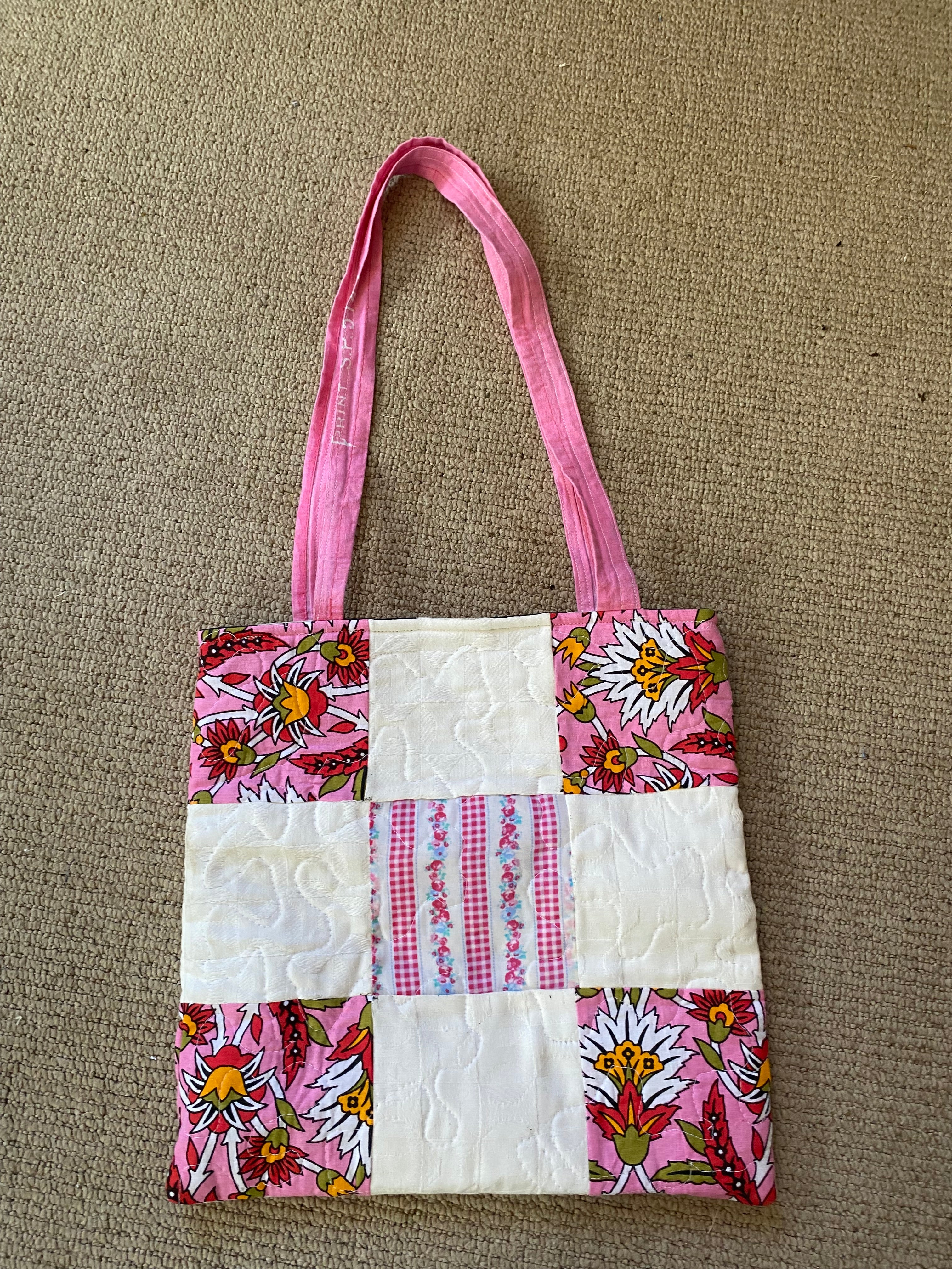 Dusty pink floral quilted padded shoulder bag.