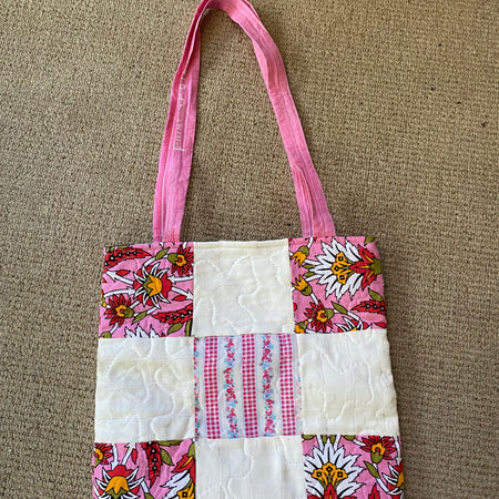 Dusty pink floral quilted padded shoulder bag.