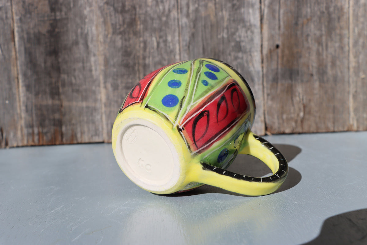 Hand-Painted Mug: Abstract yellow, red, green, black and blue mid-fire stoneware