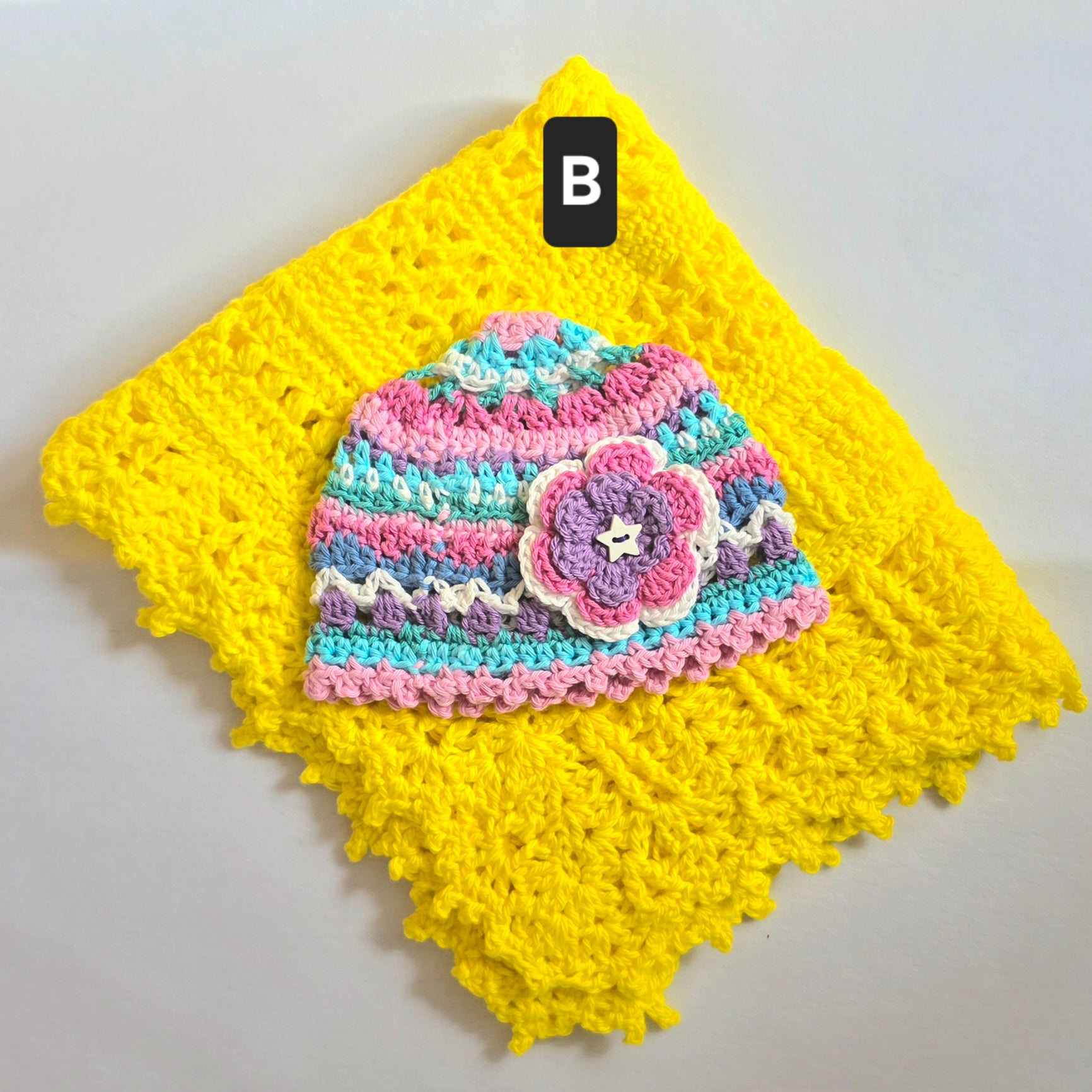 Crocheted Baby Hat with Flower Detail