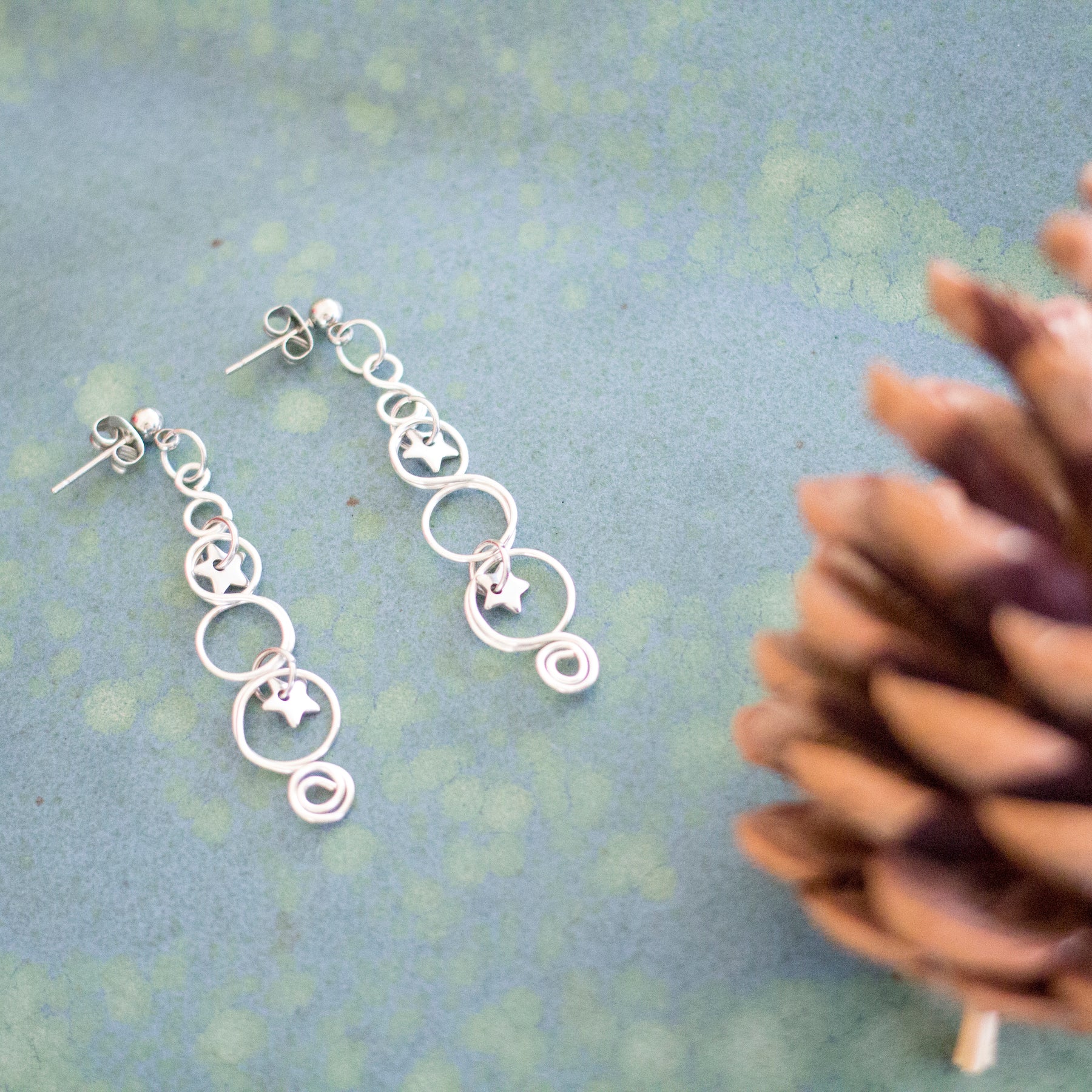 Silver Looped Earrings With Twinkling Stars | Christmas Earrings