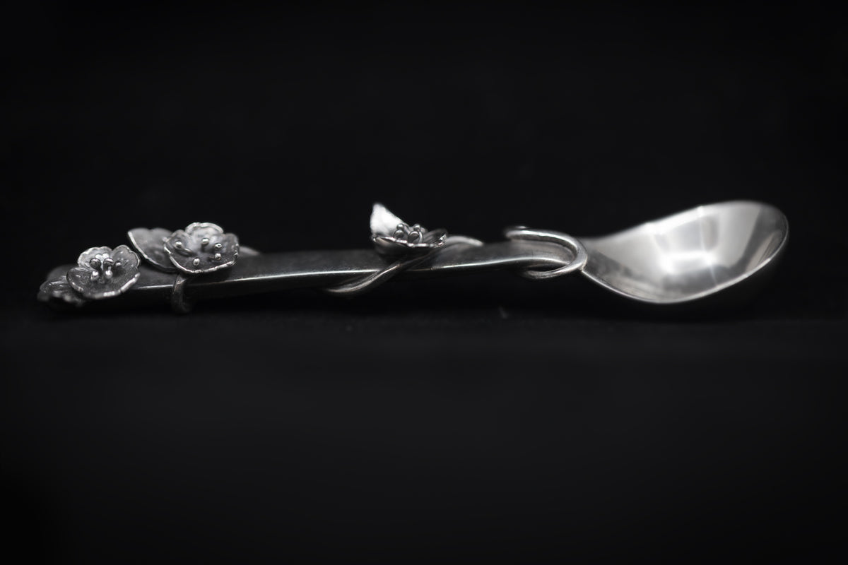 Sterling silver salt spoon with flowers