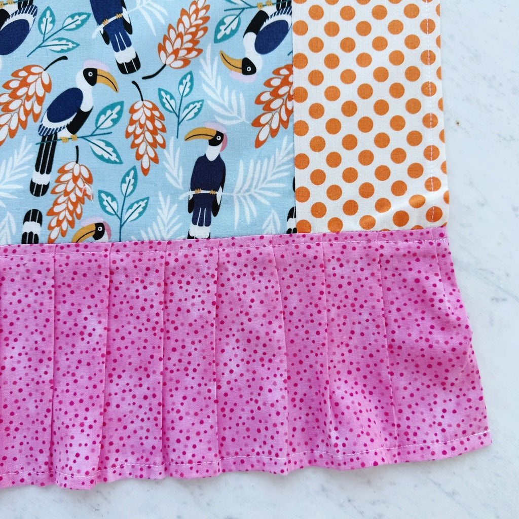 Toucans pinafore ladies apron with pocket.