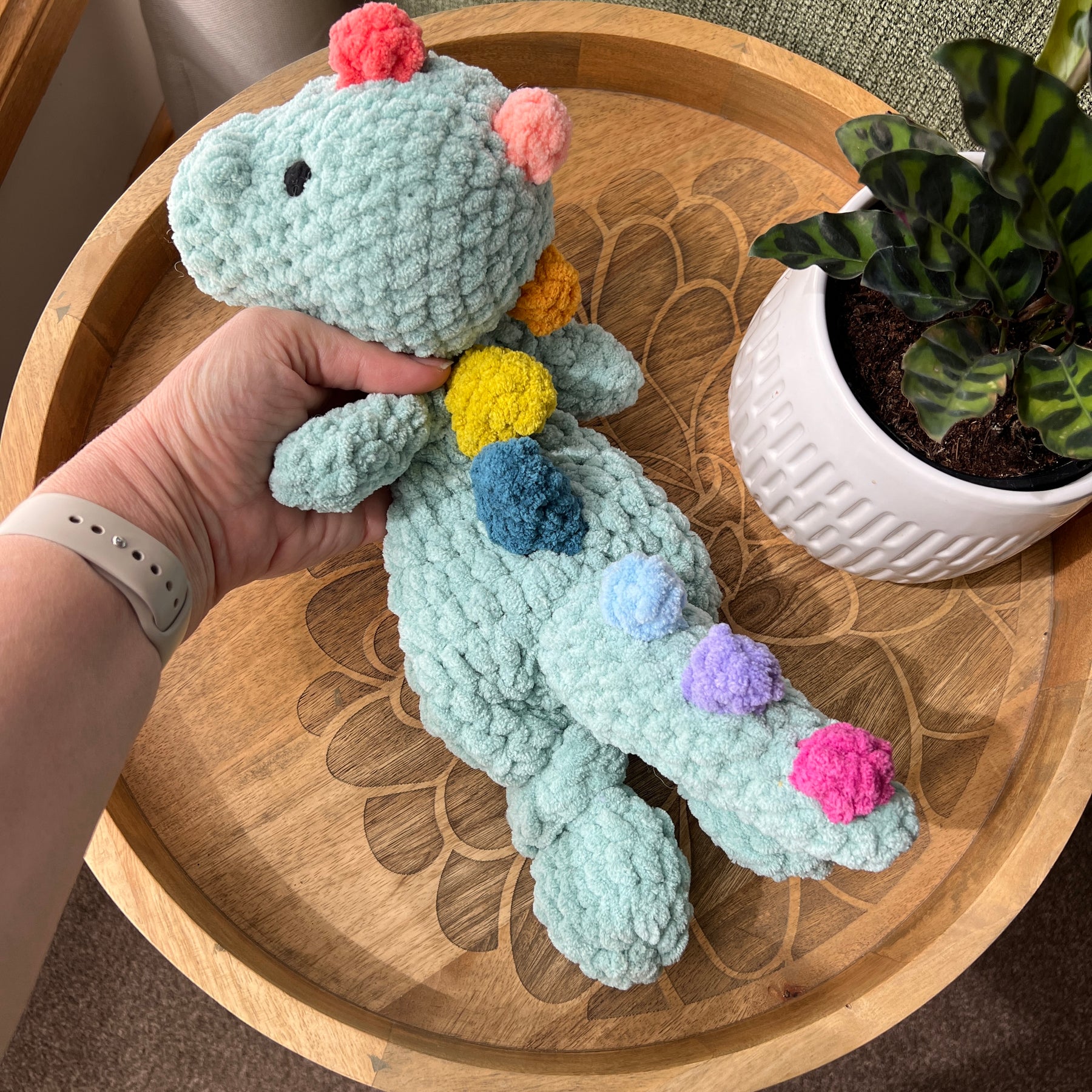 (Copy) Handmade crochet Dinosaur modern lovey snuggler with knotted legs and rainbow spikes.