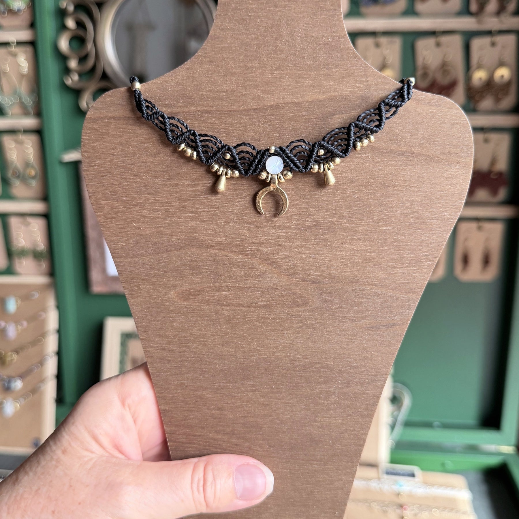 Macrame Boho Collier with gemstone bead and brass charms.