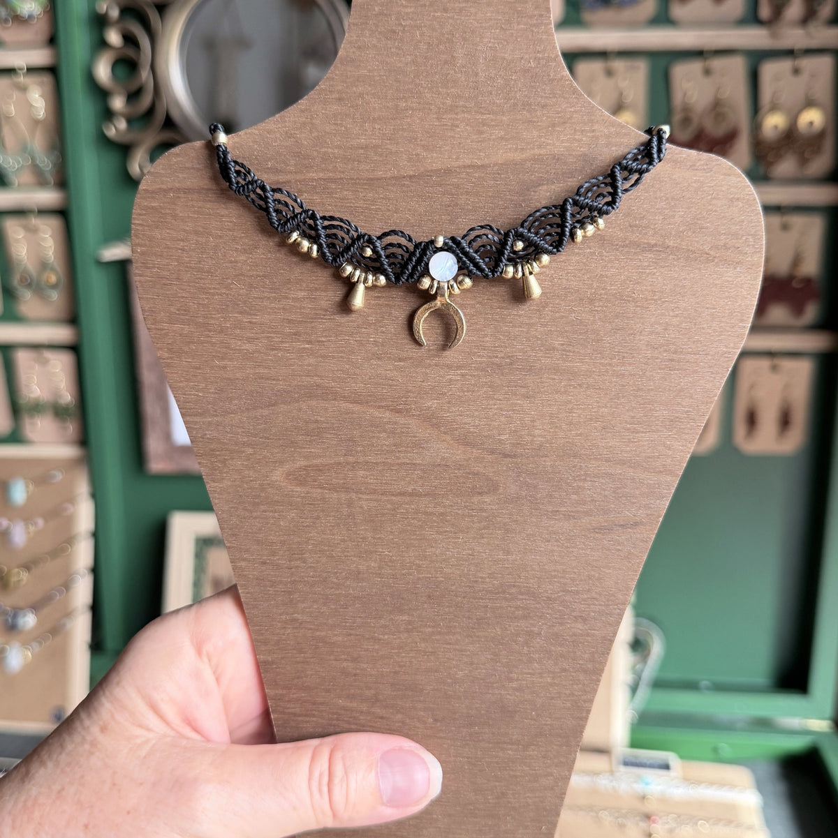 Macrame Boho Collier with gemstone bead and brass charms.