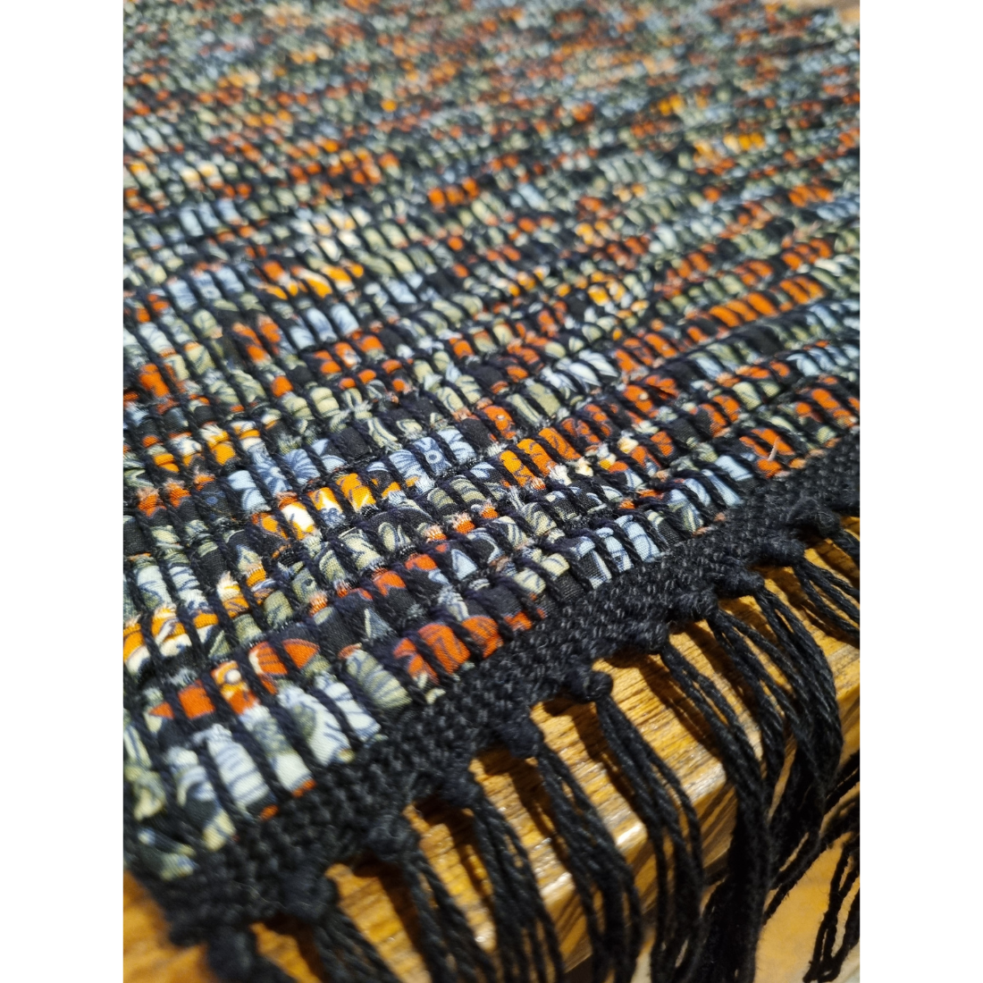 Woven black and orange floral tablerunner