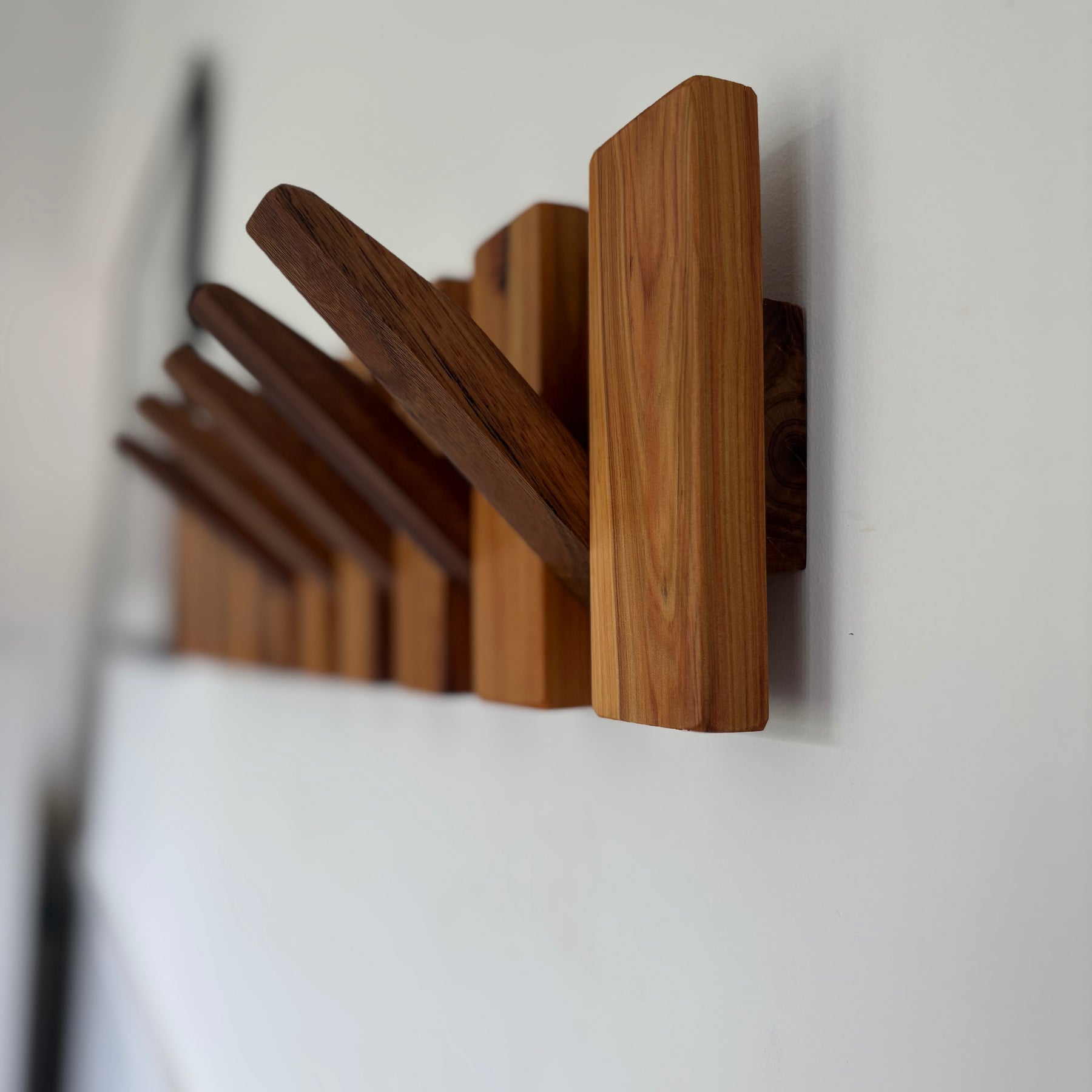 Two tone piano style coatrack